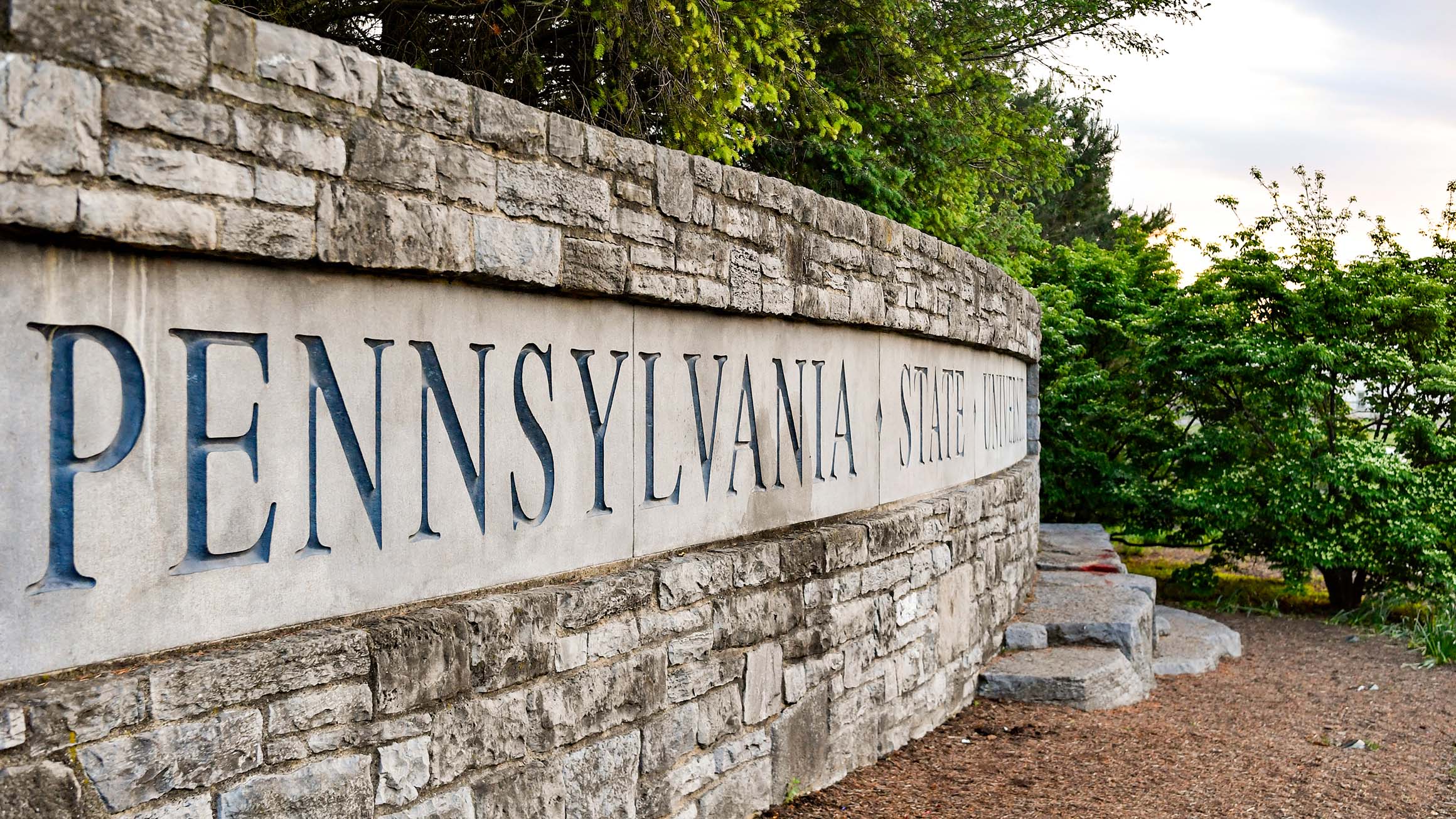 A stone sign reading Pennsylvania State University