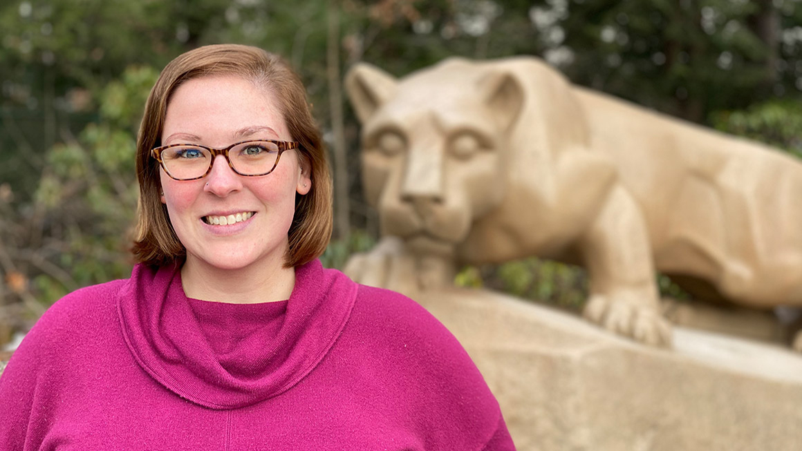 Amber Redmond stands in front of the Nittany Lion shrine.