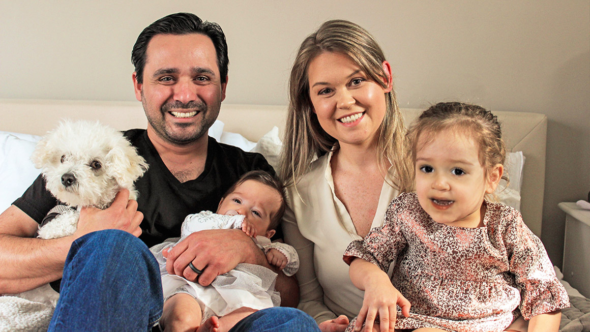 Ashish Kohli is pictured with his wife, two children and his dog.