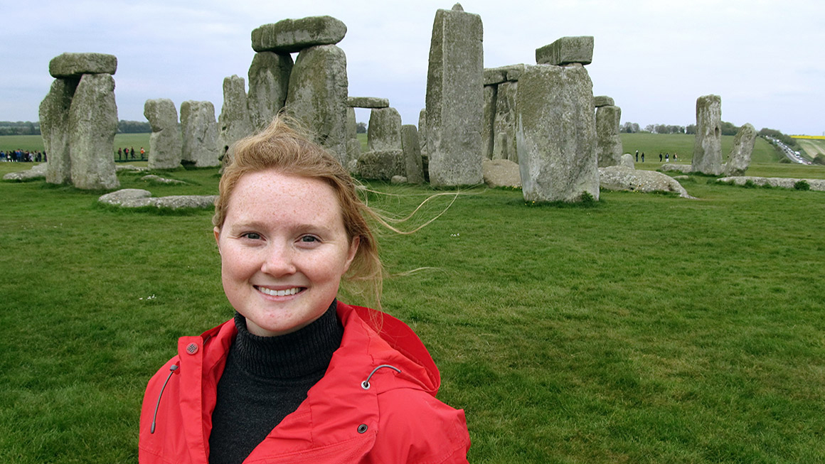 Meckler stands in front of Stonehenge