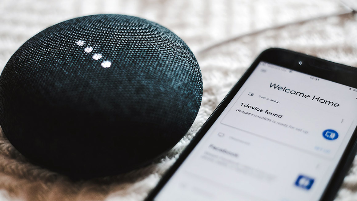 Smartphone and Google Home on a table