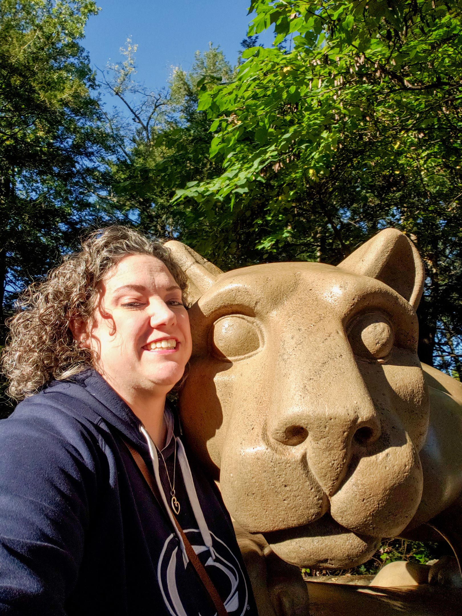 Emily Bowmer takes a selfie in front of the Nittany Lion Shrine at Penn State.