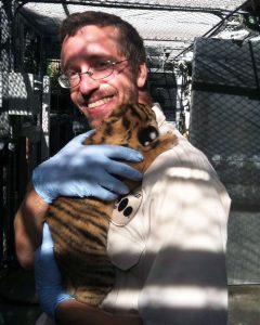 Zookeeper with a cub