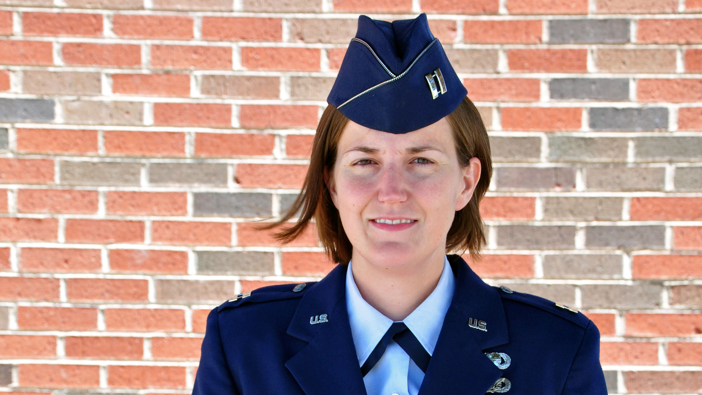 A portrait of Lauren Maloney in a blue military uniform