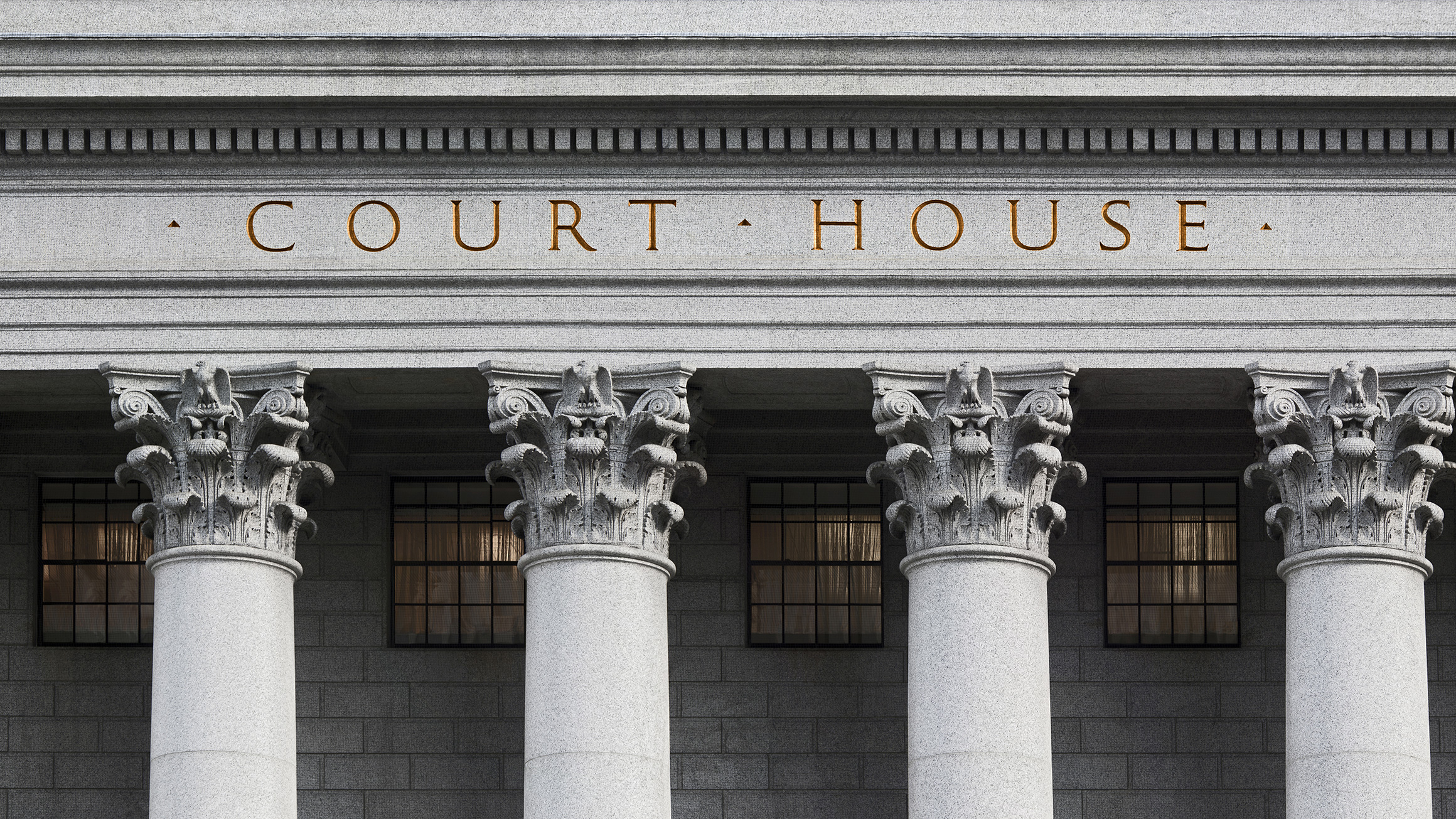 The word "courthouse" appears at the top of a building with four columns showing
