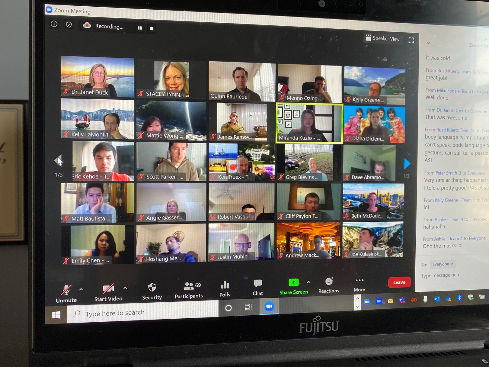 A laptop screen shows the attendees who are video conferencing in the online MBA's virtual residence.