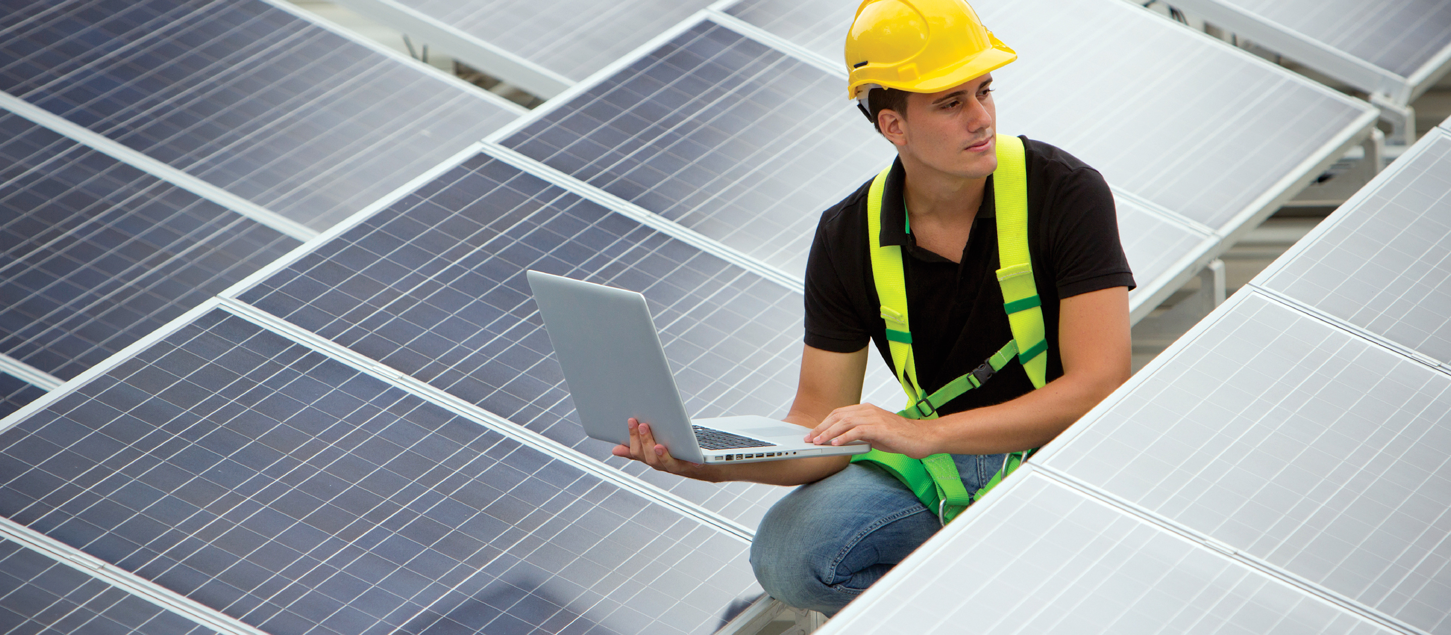 Technician working on solar panels