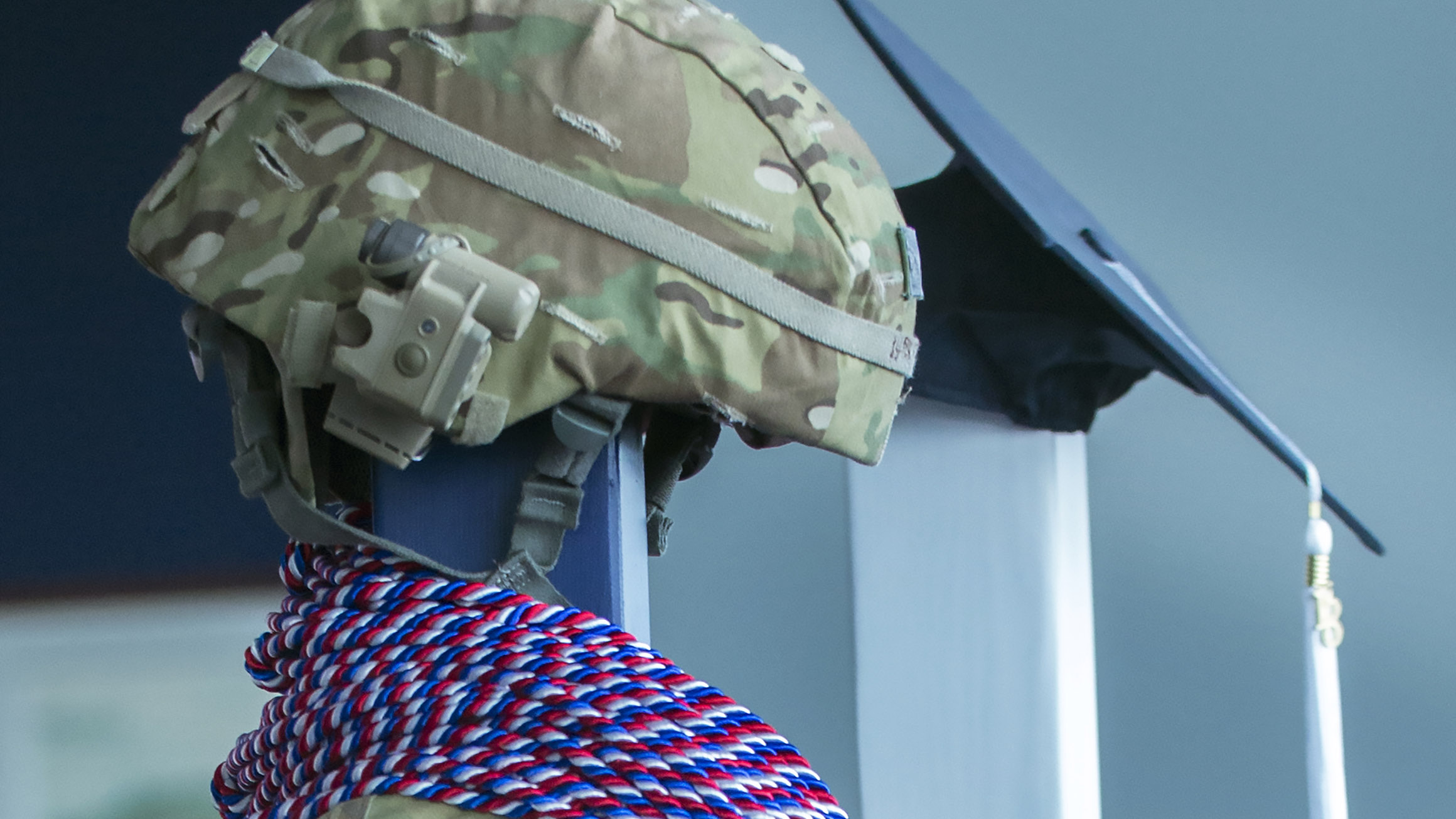 Military helmet on stand with military honor cords