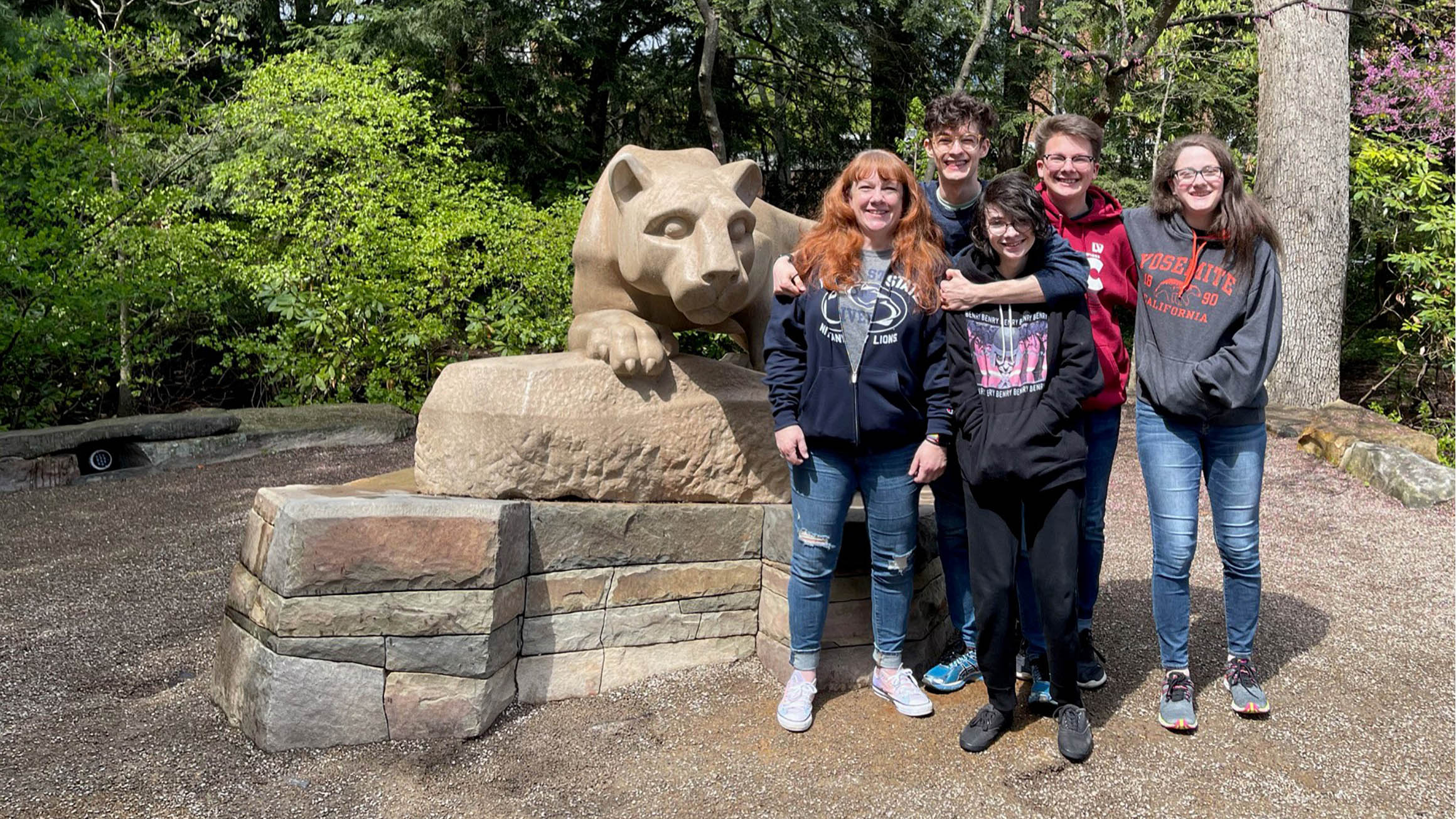 Rebecca Liebman and her four grown children stand beside the Nittany Lion Shrine.