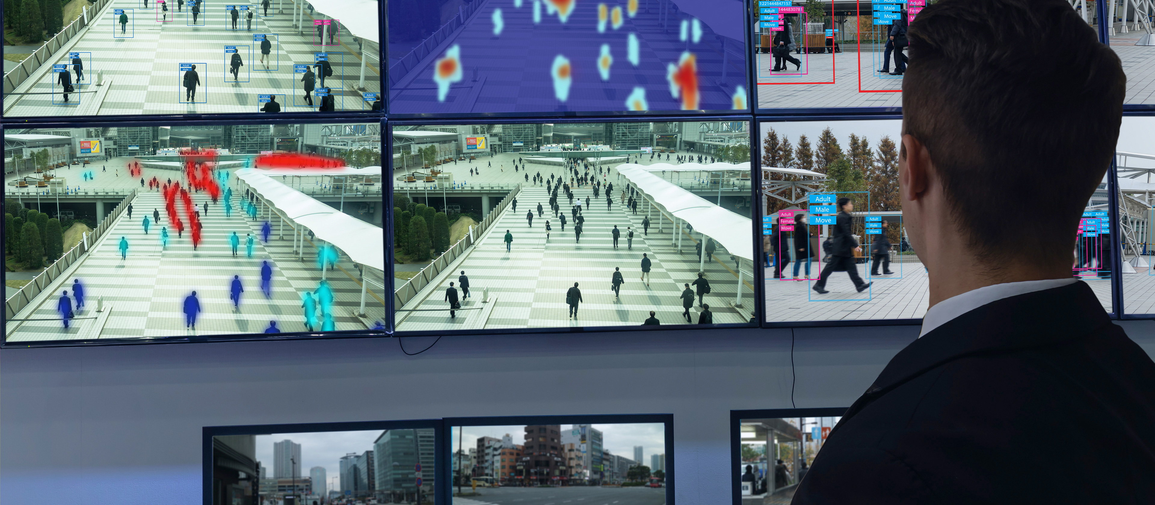 Decorative image of man watching multiple security monitors