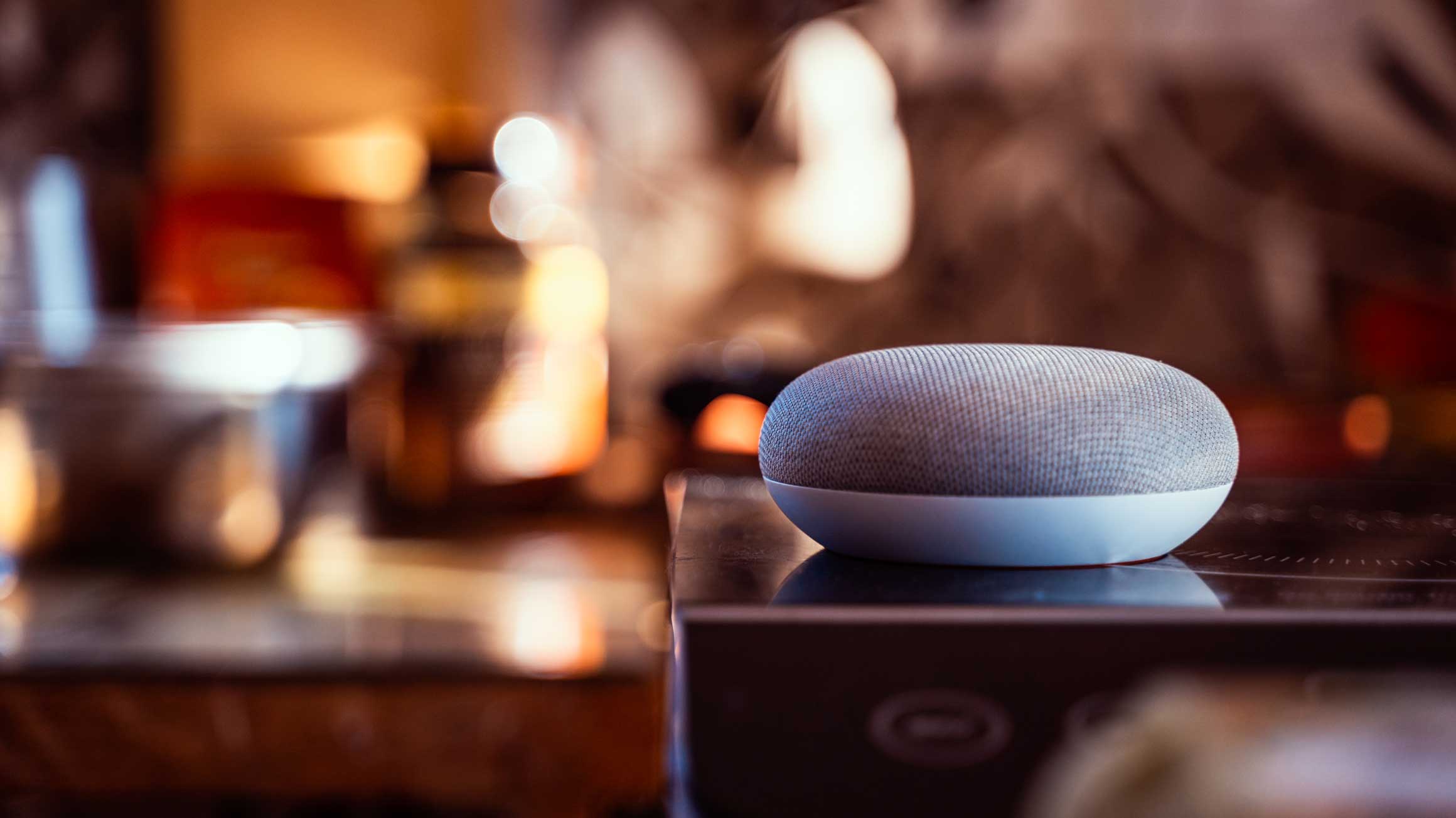 A Google Home device sits on a surface.