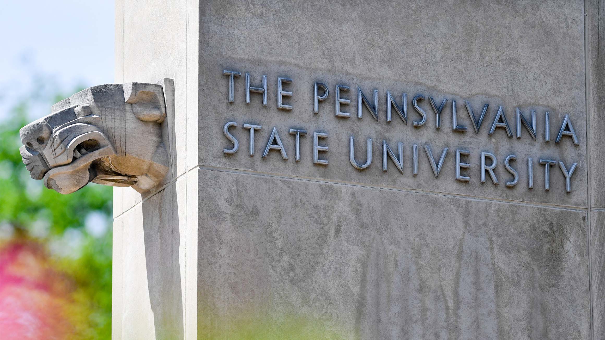 A concrete wall says "The Pennsylvania State University"