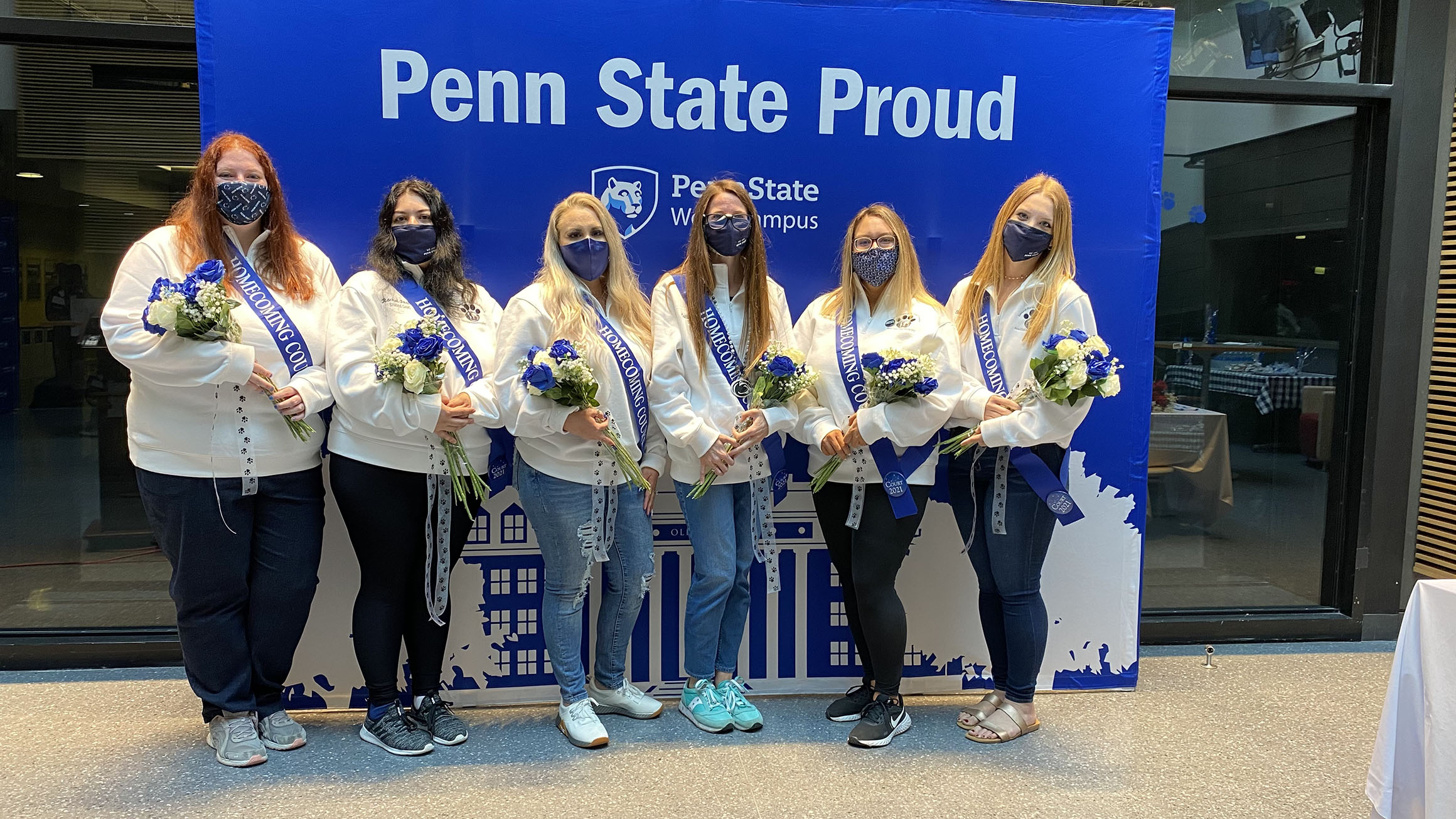 The five members of the Penn State Homecoming Court pose for a photo during the recognition ceremony.