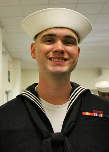 Bryan Hill wearing a Navy sailor uniform