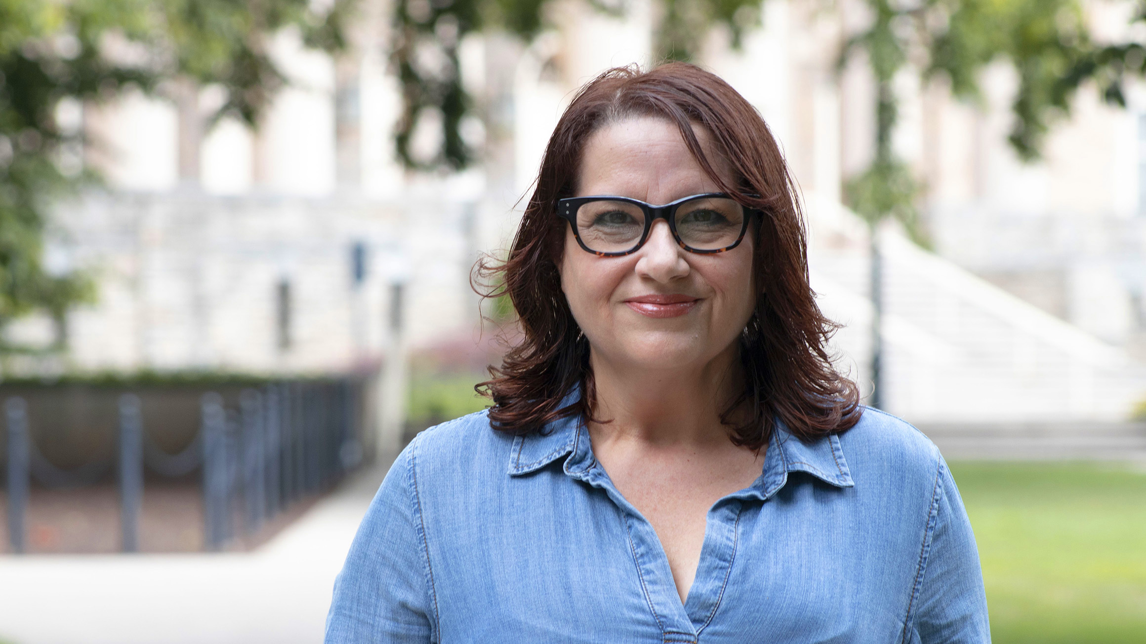 Lourdes Mestre stands in front of Old Main.