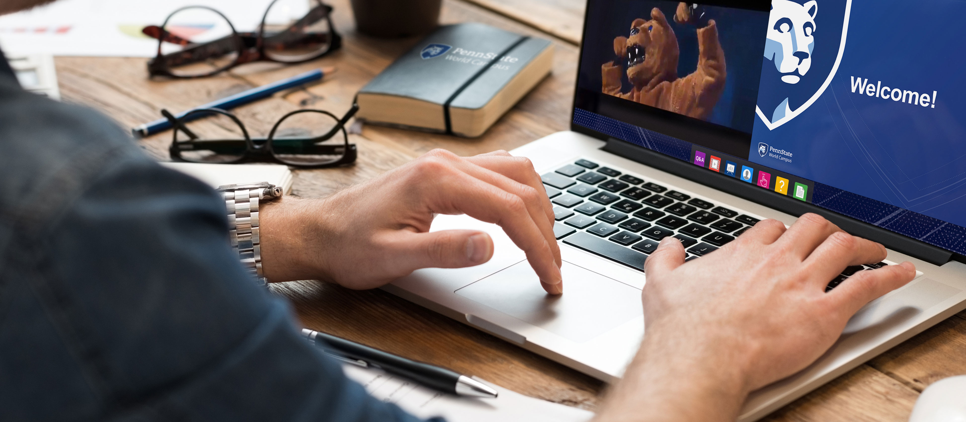 Person viewing a webinar on a laptop