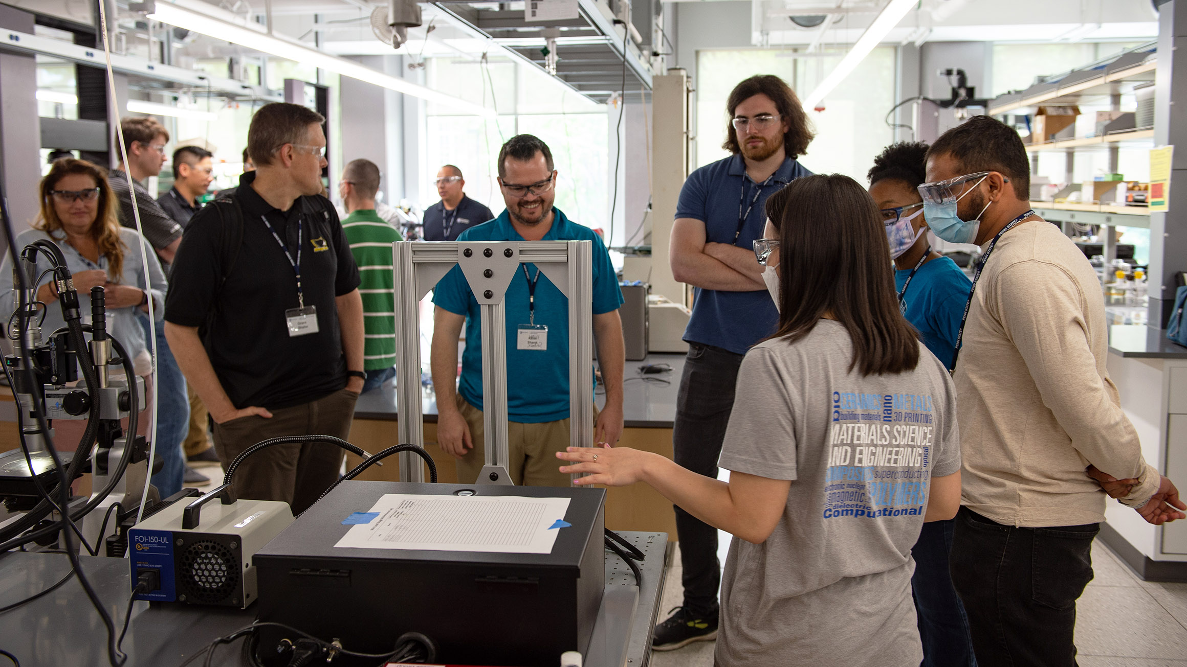 Students are told about equipment in an engineering lab