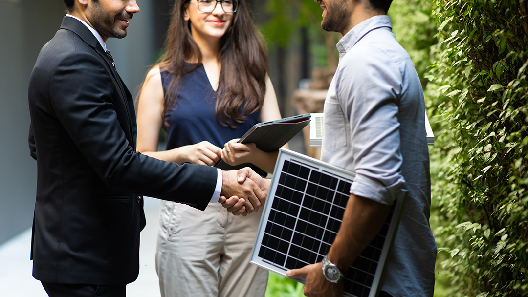 An energy sustainability professional meeting with business partners