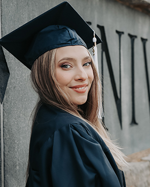 Brittany DiMaio wearing a graduation cap and gown 