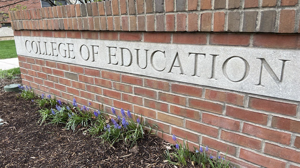 A brick sign that says "College of Education."