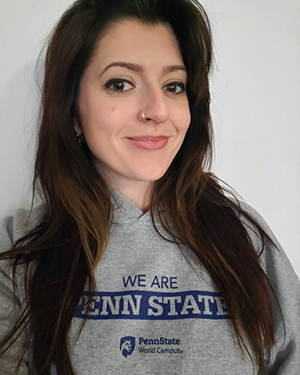 A photo of Morgan Blake wearing a gray Penn State World Campus sweatshirt.