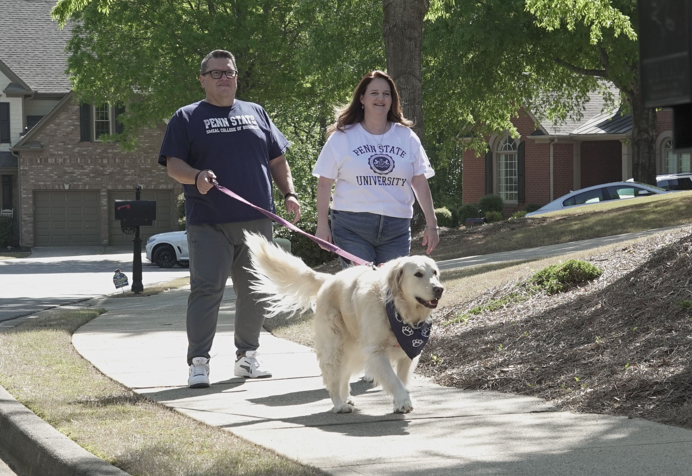 Luis and Tracey Carrillo walking in their neighborhood