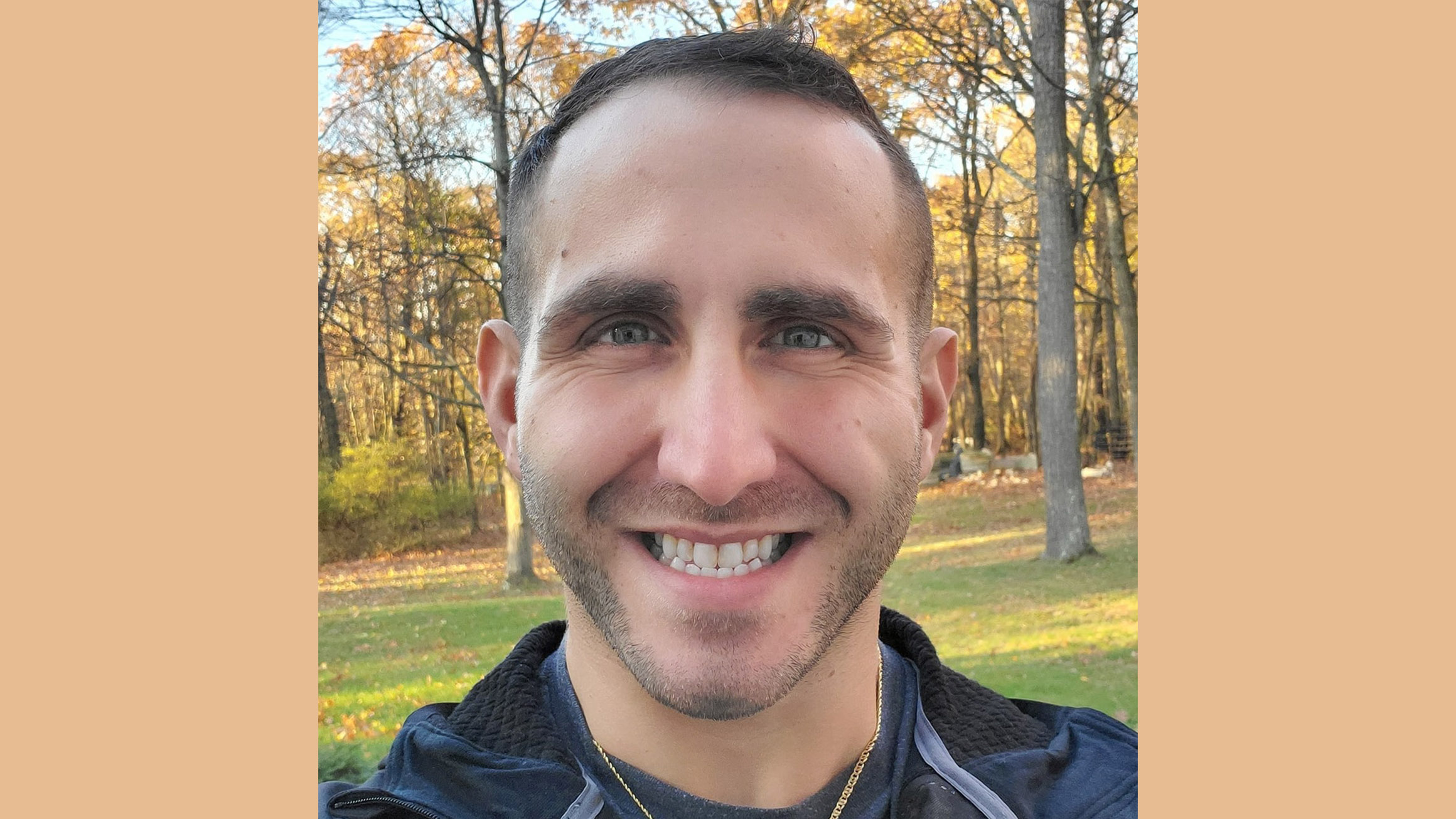 Joshua D'Ottavio headshot with trees in the background