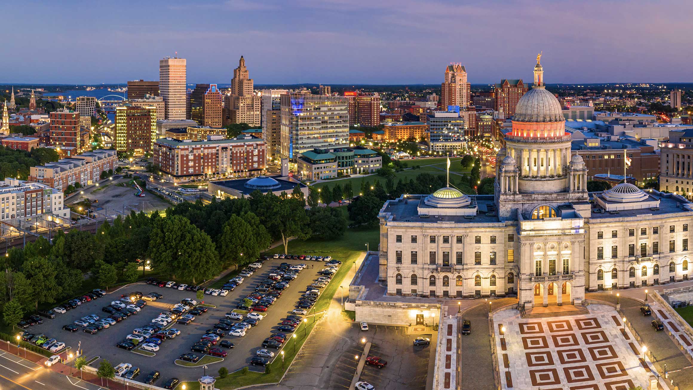 a capitol building and a parking lot