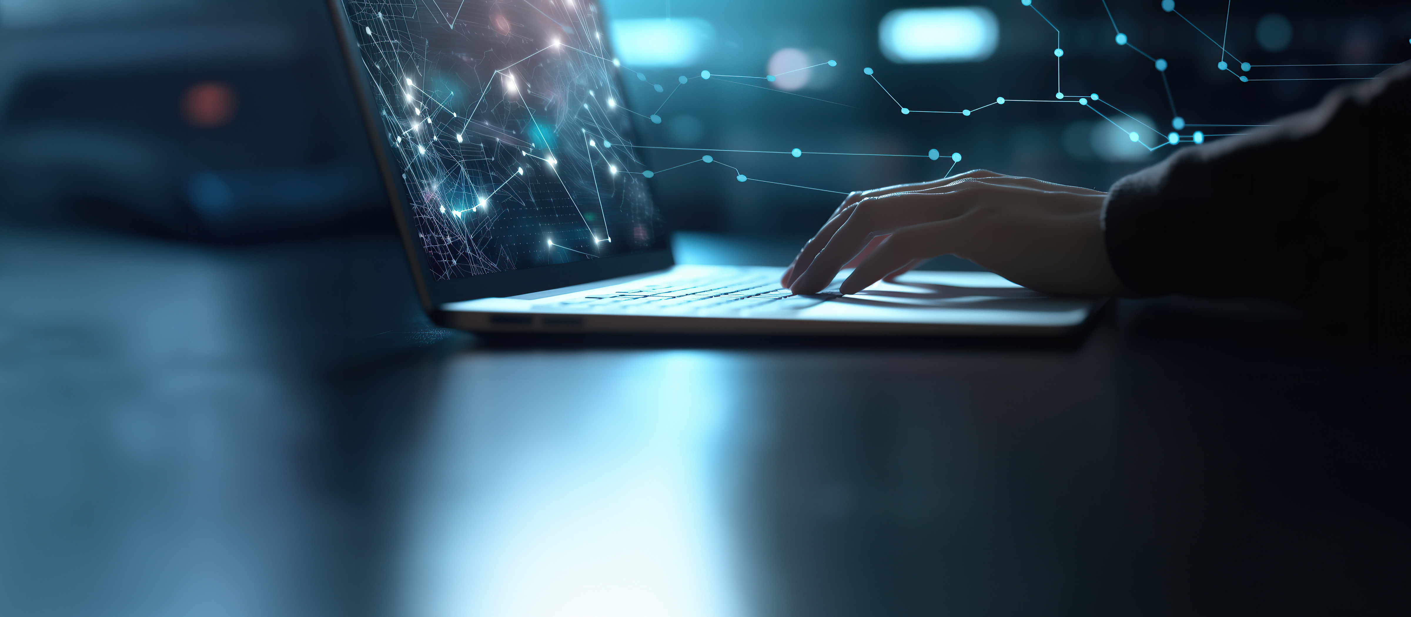 close-up of hands typing on a laptop