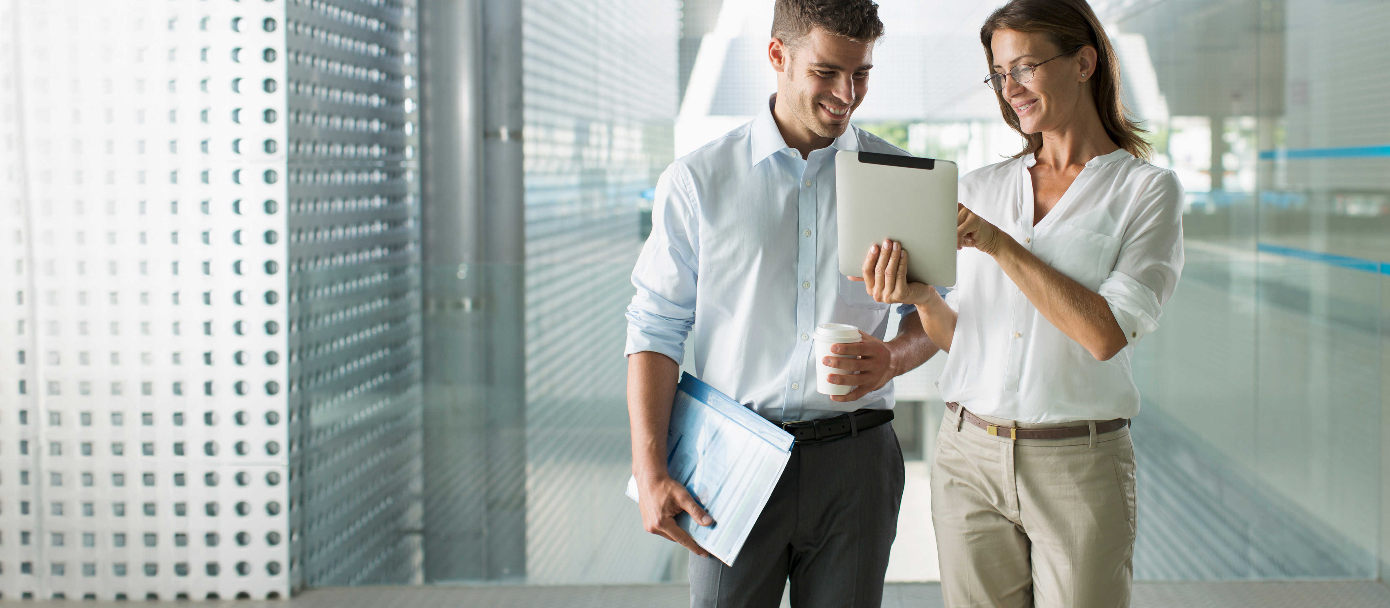 professionals looking at a tablet