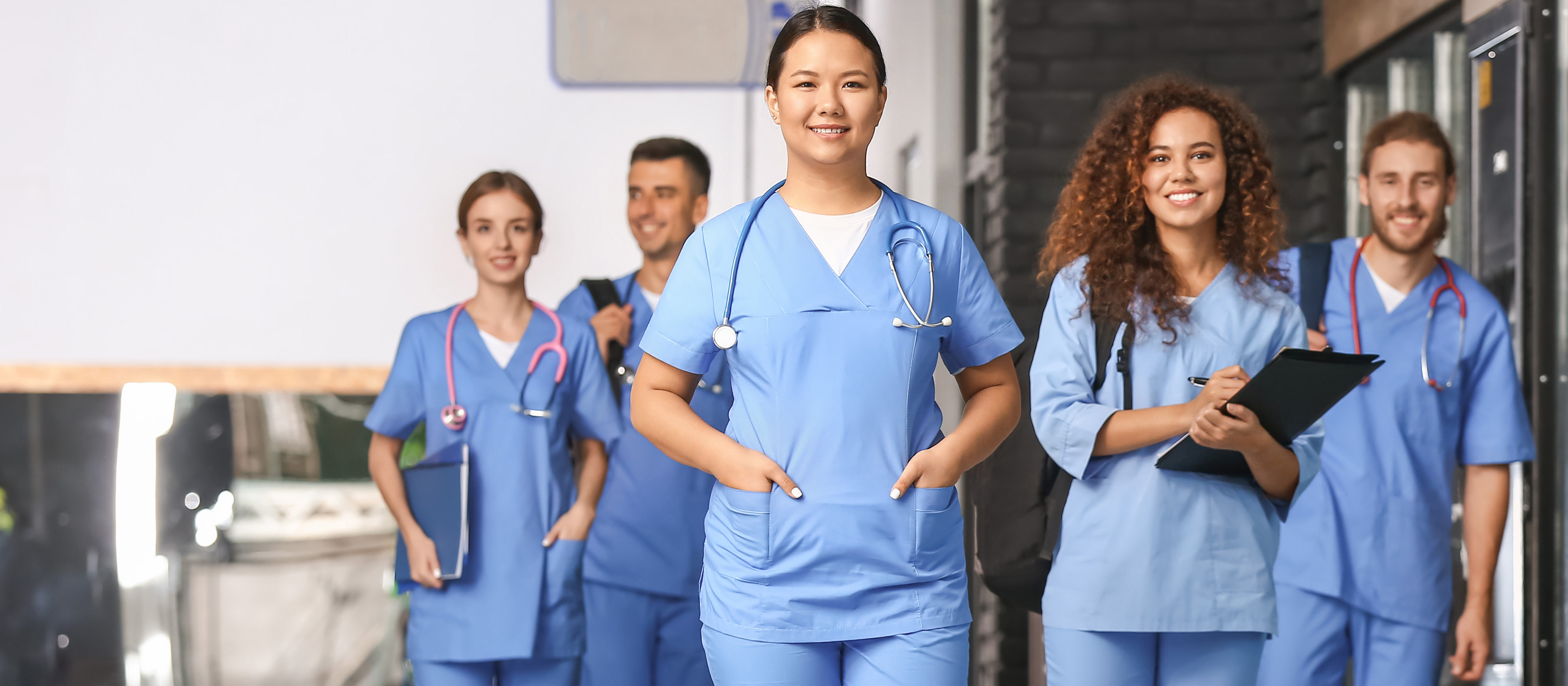 group of nurses smiling at the camera