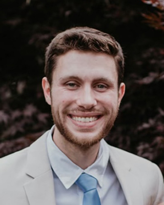 A man wearing a suite and tie.