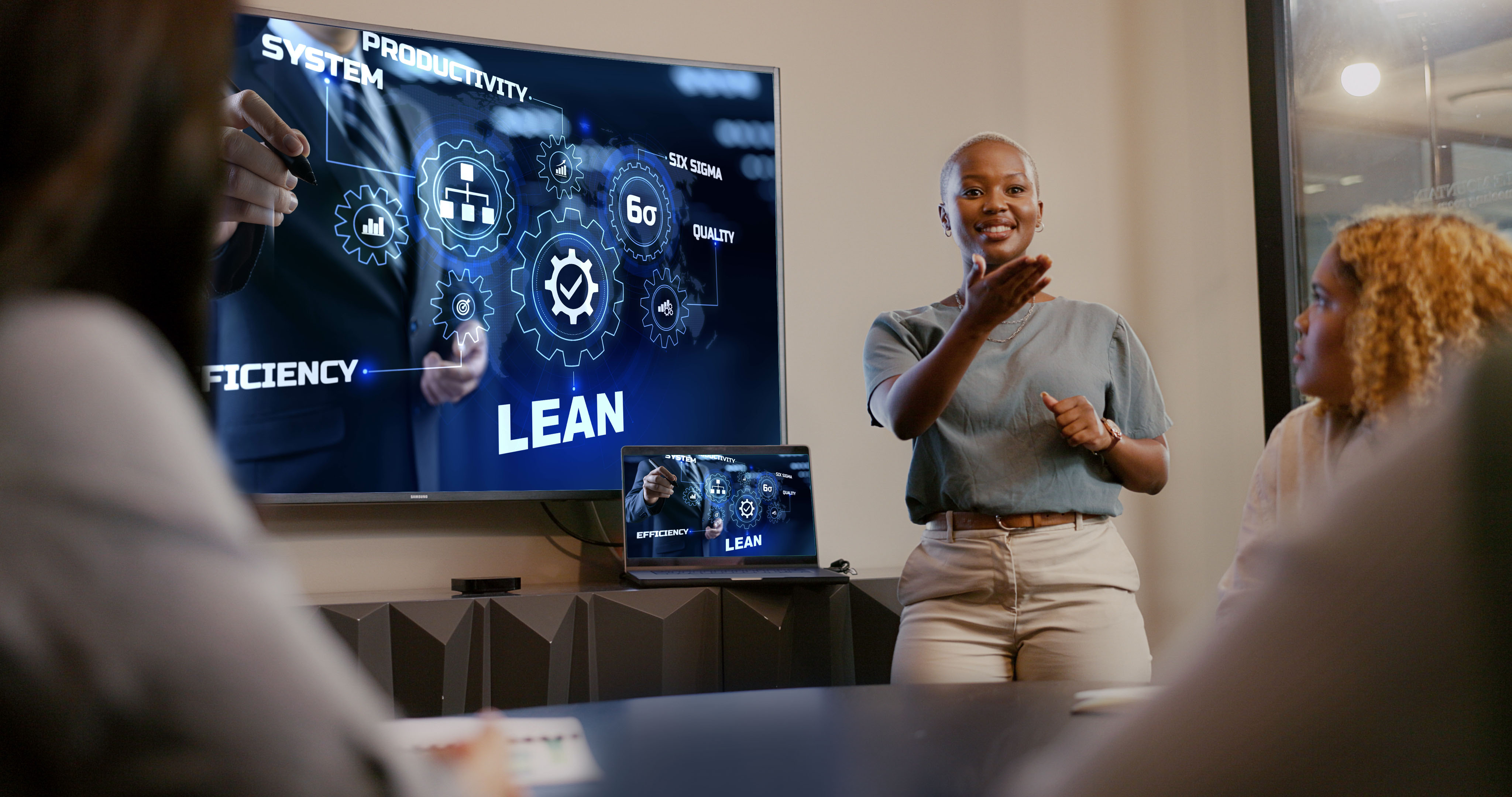 businesswoman giving presentation to colleagues