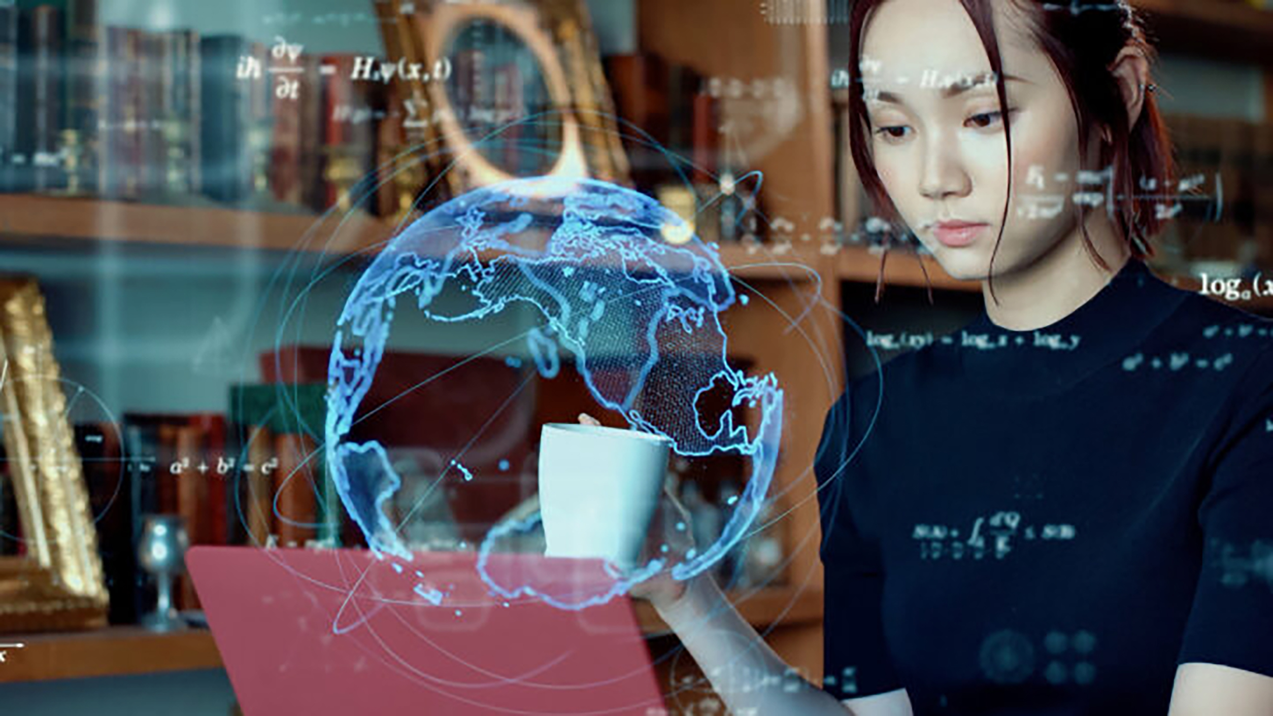 A photo of a woman at a computer.