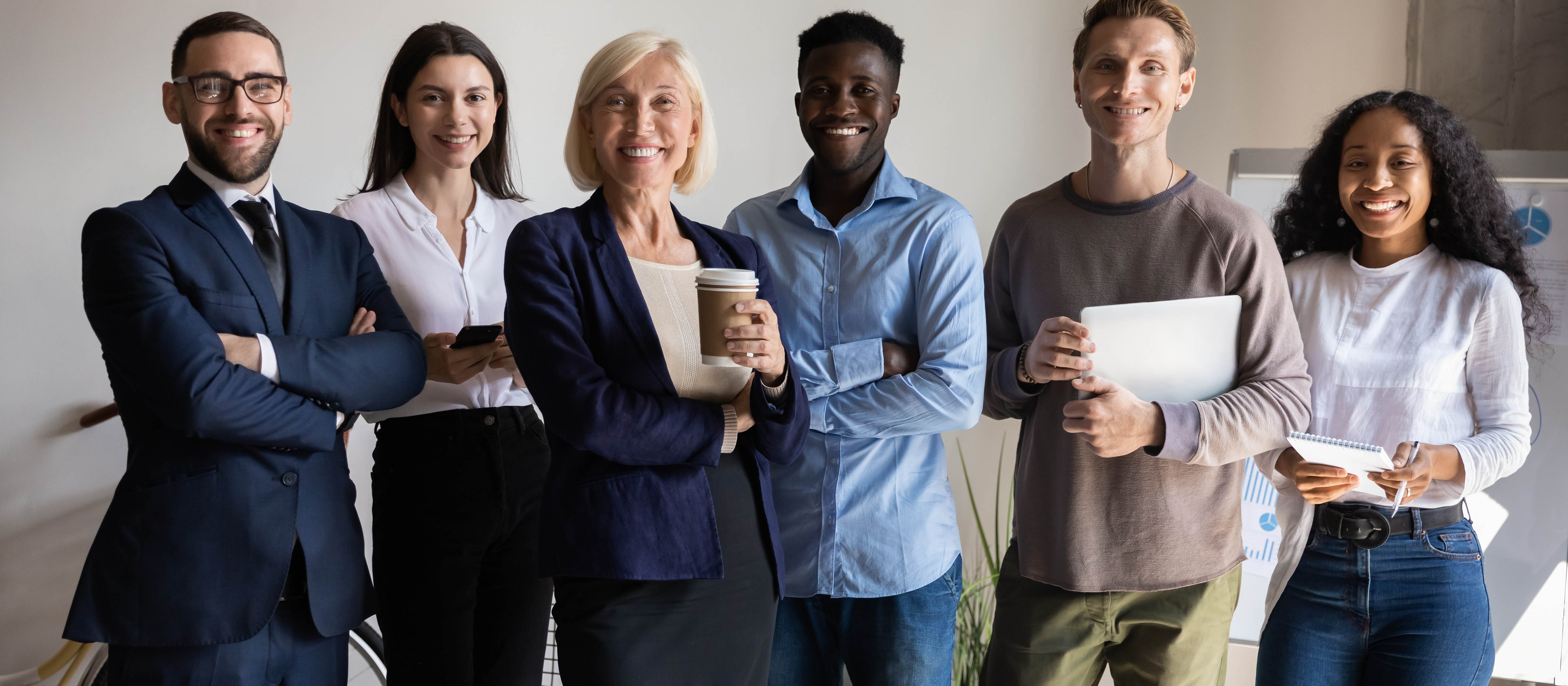 group of professionals smiling at the camera 