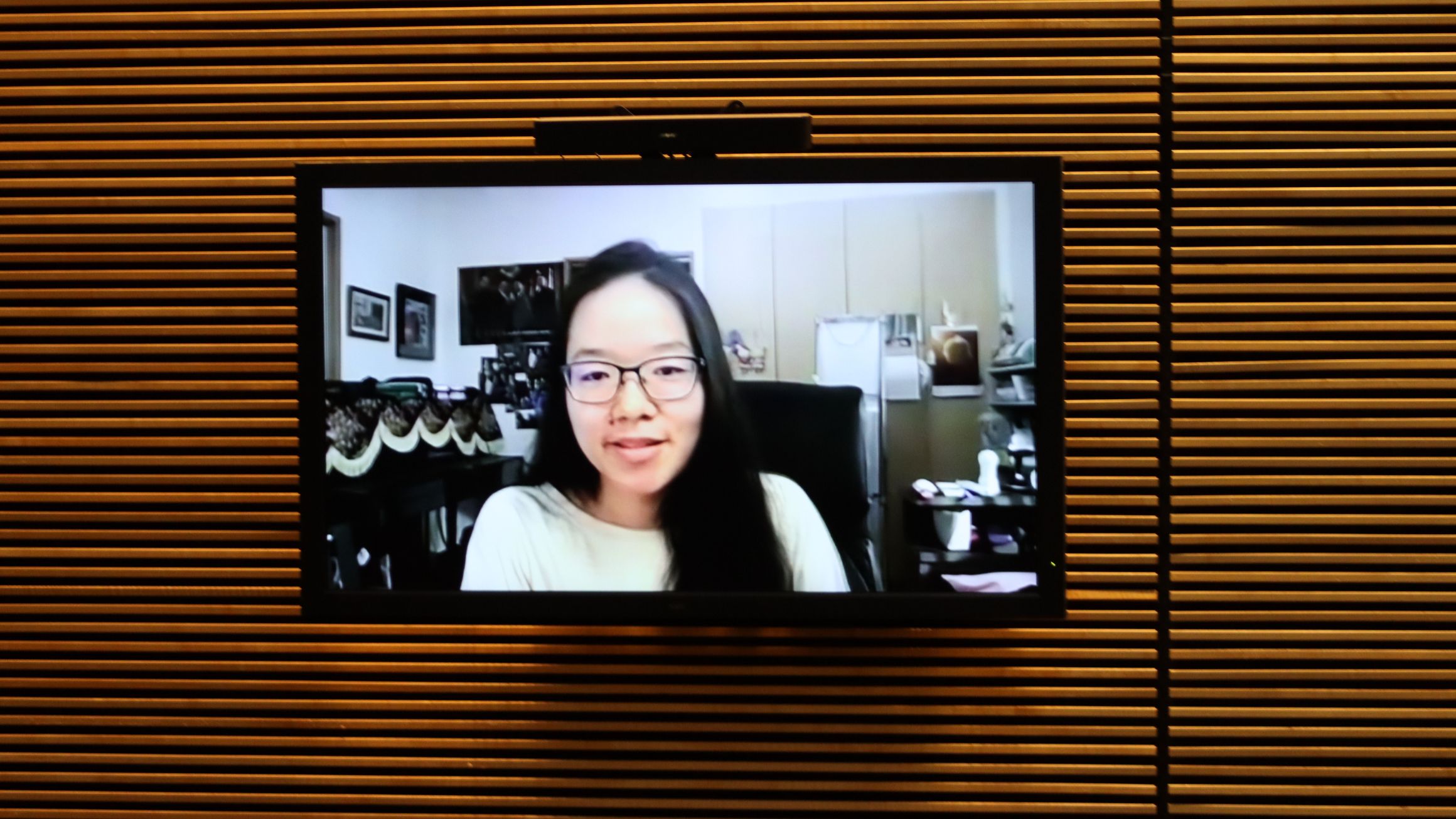 a woman is shown on a screen