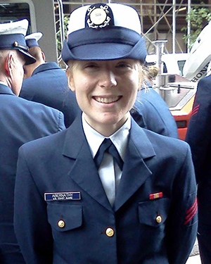 A woman wearing a Coast Guard uniform.