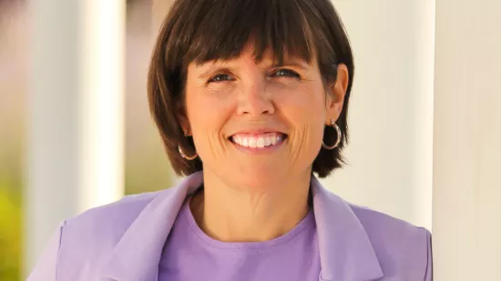 Headshot of Tracie Edwards in a purple blazer.