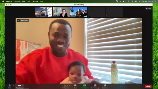 Segun Ajisafe is seeing on the Zoom screen with his baby.
