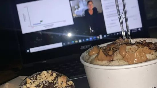 MBA student Zain Retherford shared a photo that shows two snacks, oatmeal and a donut, on his desk as he's listening to the residency program.