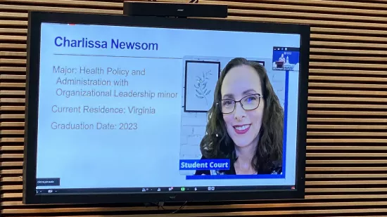 A presentation slide shows Charlissa Newsom