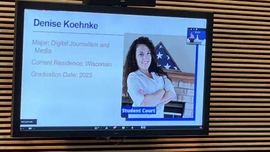 A presentation slide shows Denise Koehnke
