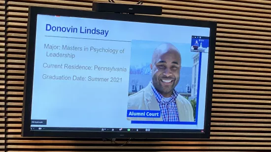 A presentation slide shows Donovin Lindsay
