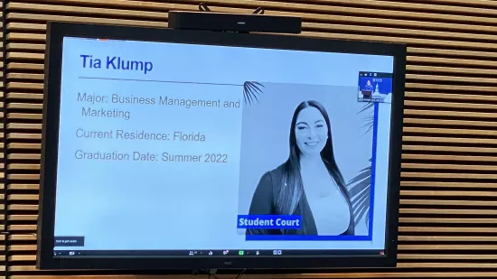 A presentation slide shows Tia Klump