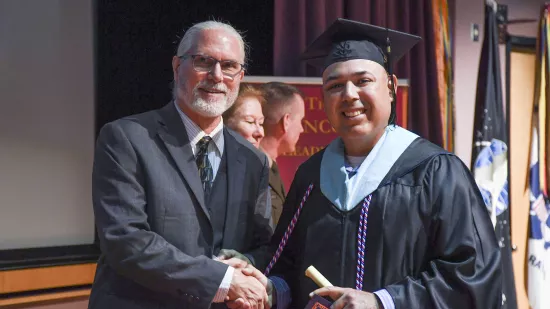 Robbie Sierra shakes hands with Will Diehl