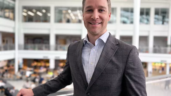 Dan Yesenosky stands in along a balcony HUB-Robeson Center