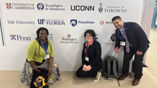 Three representatives of the Penn State delegation pose for a photo at COP28