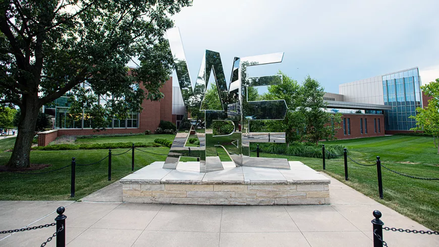 The We Are shrine at Penn State shows the word "We" on top of "Are"