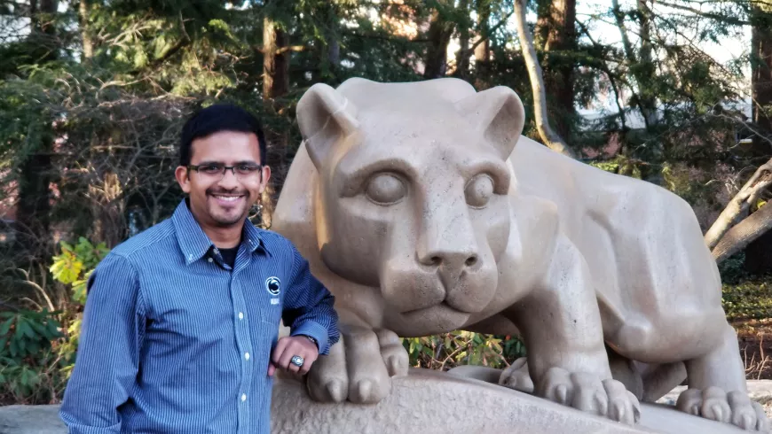 Pavara Ranatunga poses on the left side of the Nittany Lion Shrine.