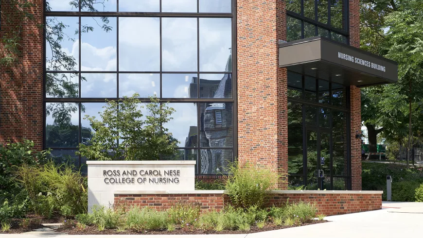 a sign says rose and carol nese college of nursing in front of a building